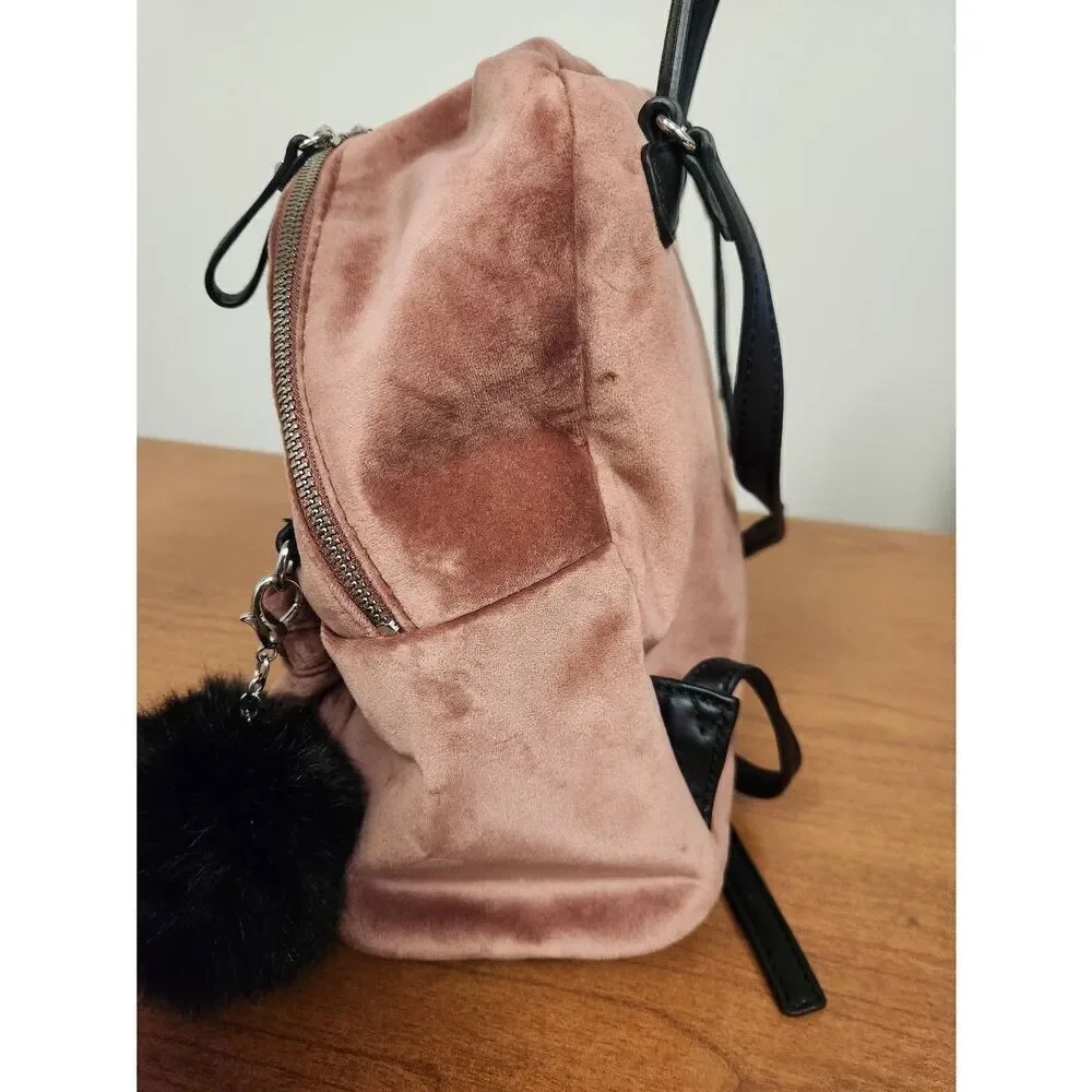 Guess small velvet feel pink backpack with black straps and pom. Measures approx